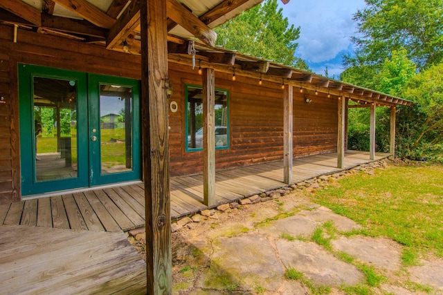 view of side of property featuring french doors