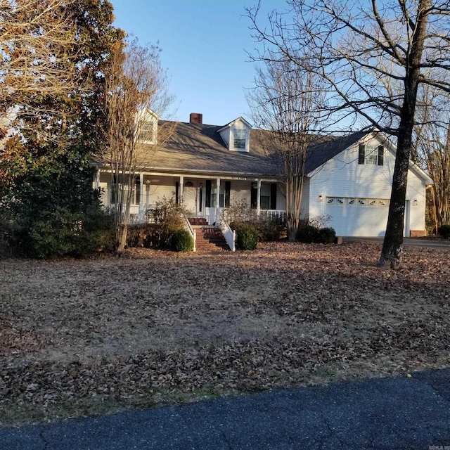 view of front of property with a porch and a garage