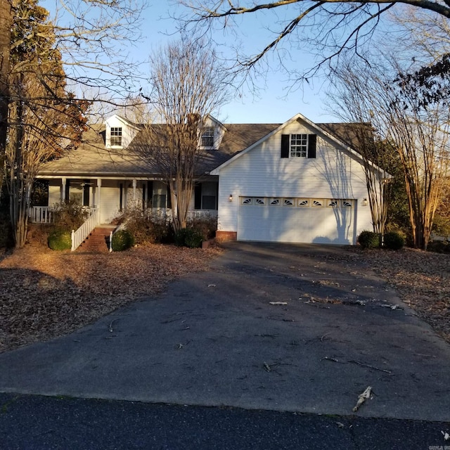 view of front of house with a porch and a garage