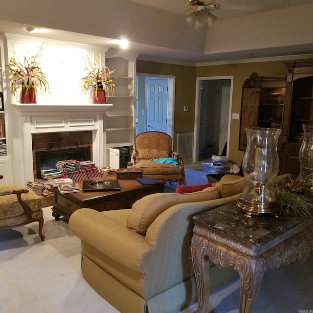 living room featuring built in features and a fireplace