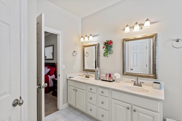 bathroom with tile patterned flooring and vanity