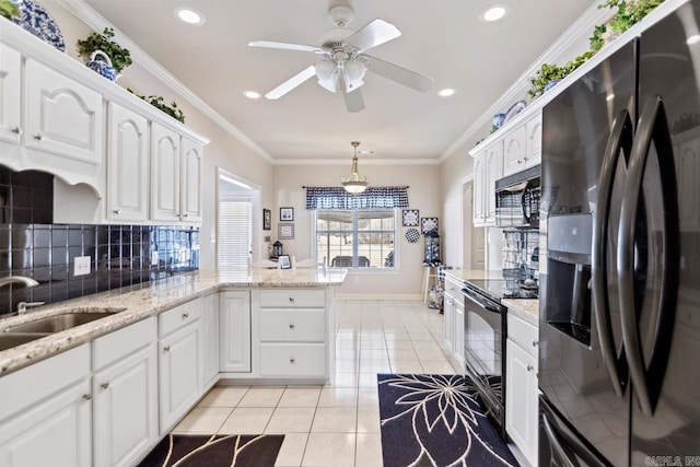 kitchen with white cabinetry, kitchen peninsula, pendant lighting, light tile patterned floors, and black appliances