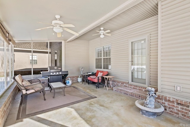 sunroom with ceiling fan and a wealth of natural light