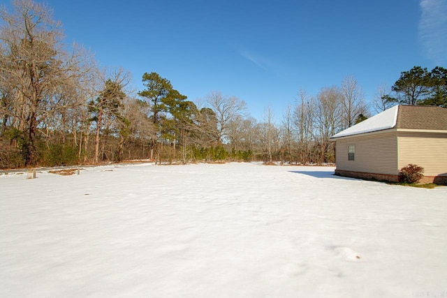 view of yard covered in snow