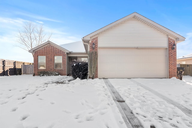 ranch-style house featuring a garage