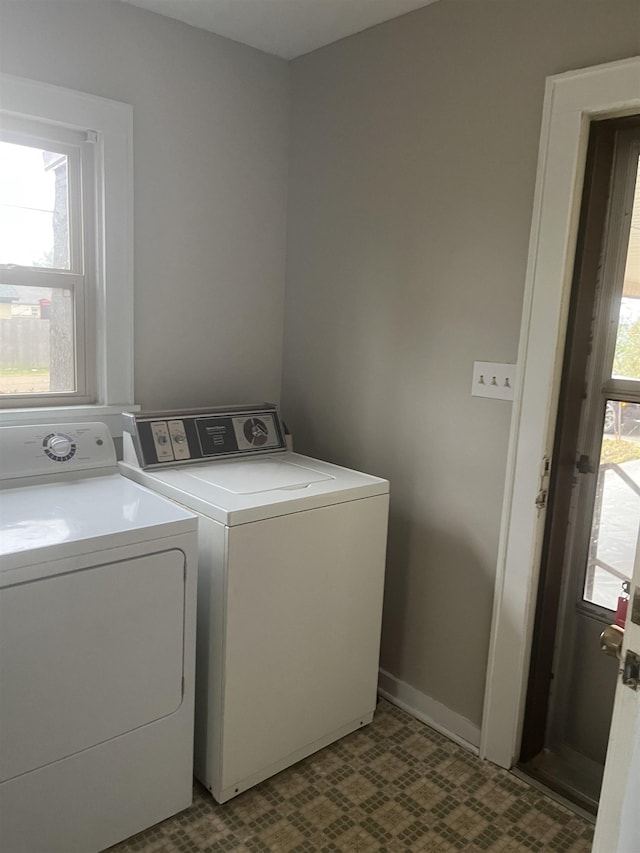 laundry room with washing machine and clothes dryer