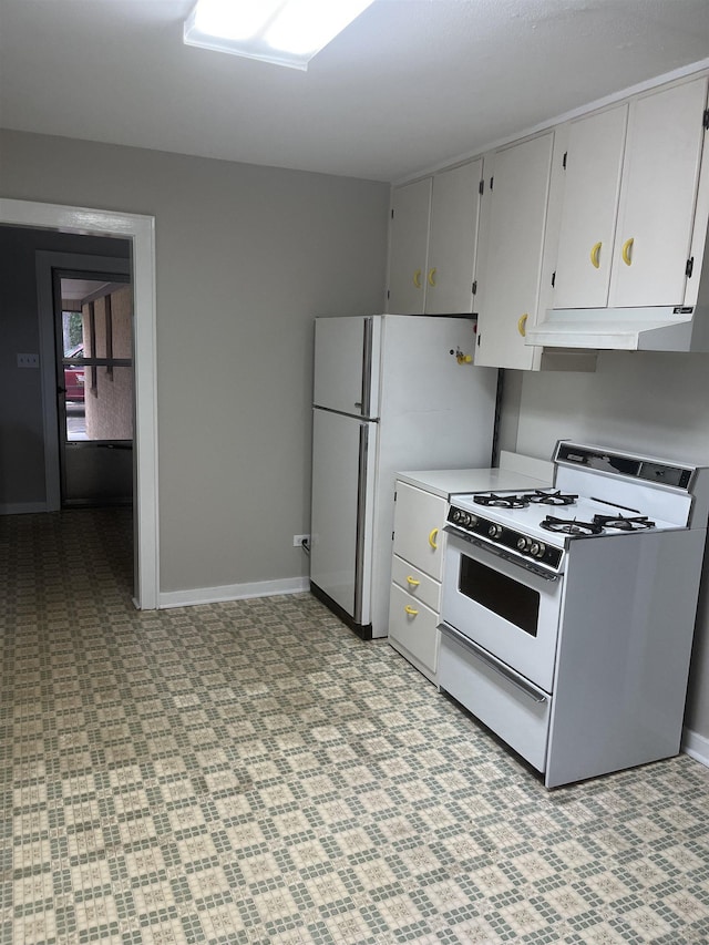 kitchen with white cabinets and white appliances