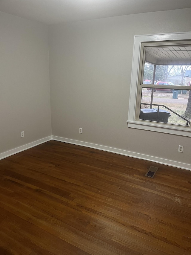 empty room featuring dark hardwood / wood-style floors