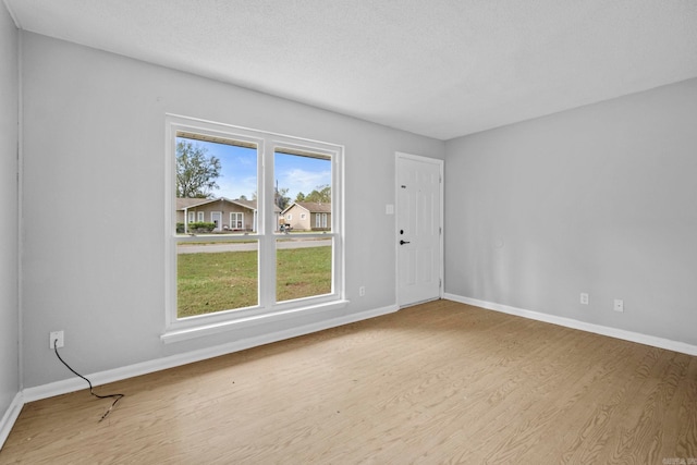 spare room with light wood-type flooring