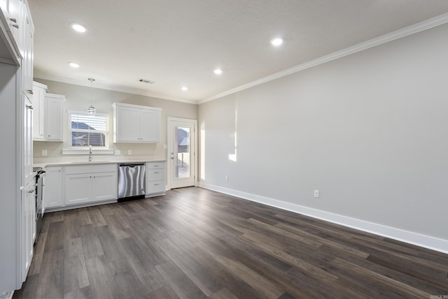 kitchen featuring stainless steel appliances, sink, pendant lighting, white cabinets, and dark hardwood / wood-style floors