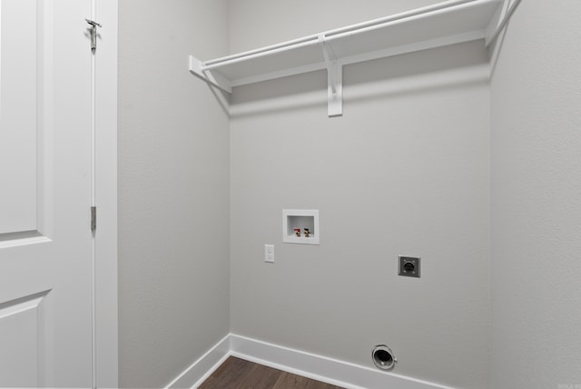 clothes washing area with hookup for an electric dryer, dark hardwood / wood-style floors, and washer hookup