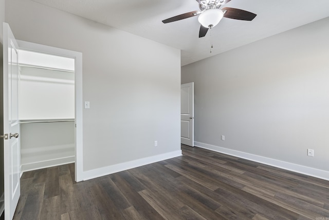 unfurnished bedroom featuring ceiling fan, a closet, and dark hardwood / wood-style floors