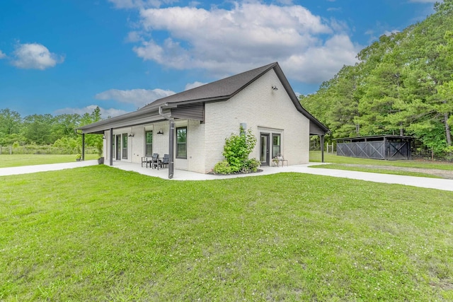 view of home's exterior with a yard