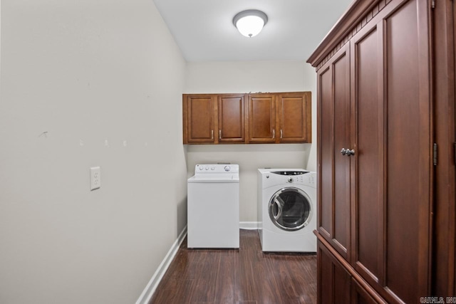 washroom featuring cabinets, dark wood-type flooring, and washer and dryer