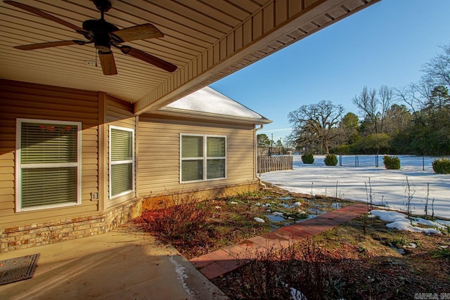 view of home's exterior featuring ceiling fan