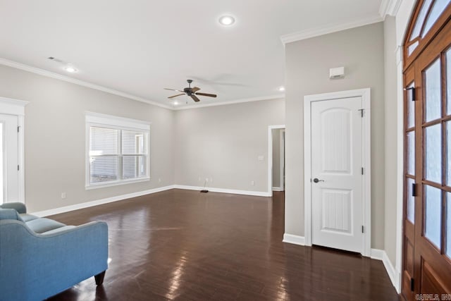 interior space featuring dark hardwood / wood-style floors, ceiling fan, and crown molding