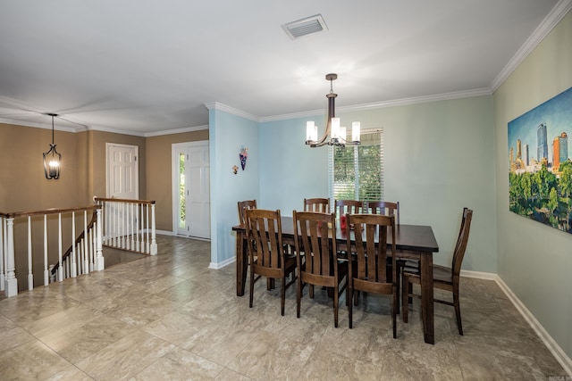 dining space with ornamental molding and an inviting chandelier