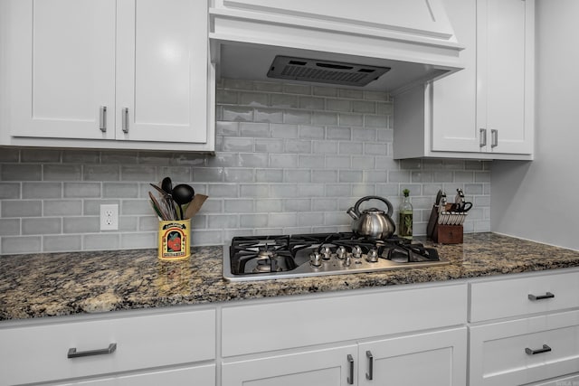 kitchen featuring decorative backsplash, white cabinetry, and stainless steel gas stovetop