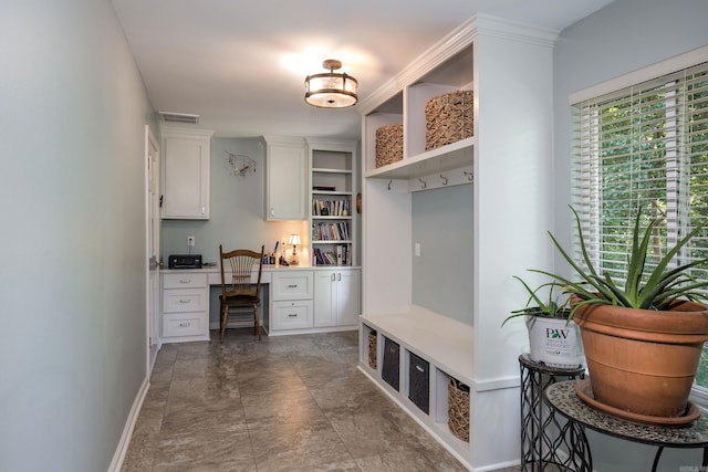 mudroom featuring built in desk