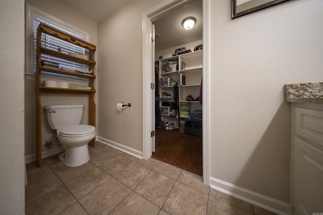 bathroom featuring tile patterned floors and toilet