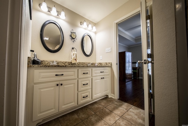 bathroom featuring vanity, tile patterned floors, and ornamental molding