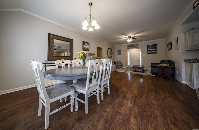 dining room with ceiling fan with notable chandelier, dark hardwood / wood-style flooring, and ornamental molding