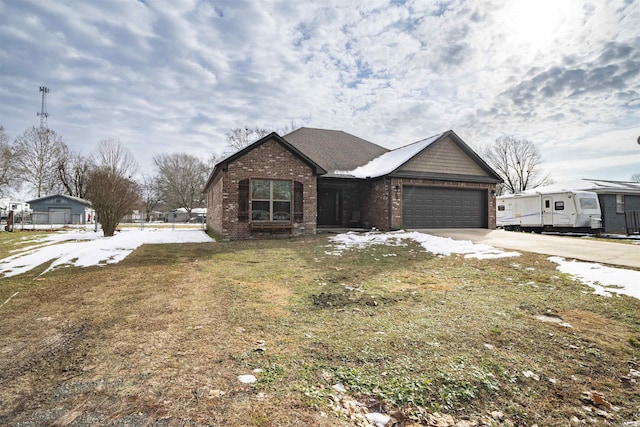 view of front of home with a front lawn and a garage