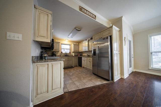 kitchen with stainless steel fridge, sink, crown molding, and light hardwood / wood-style flooring