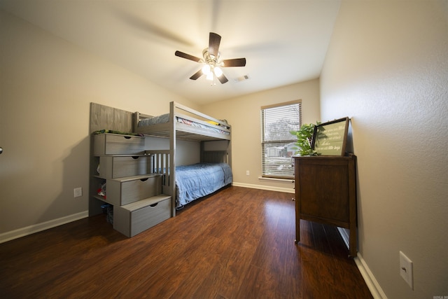 bedroom featuring ceiling fan and dark hardwood / wood-style floors