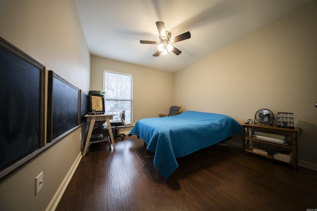 bedroom with ceiling fan and dark hardwood / wood-style flooring