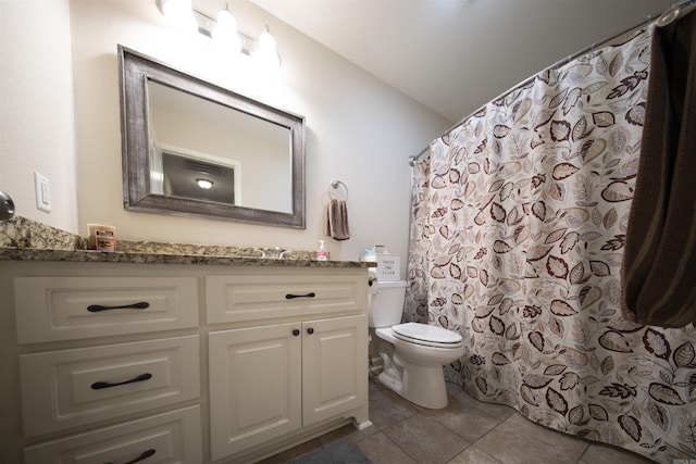 bathroom featuring tile patterned flooring, vanity, a shower with shower curtain, and toilet