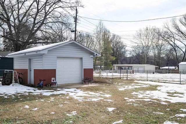 view of snow covered garage