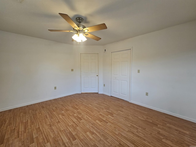 unfurnished bedroom with hardwood / wood-style floors and ceiling fan