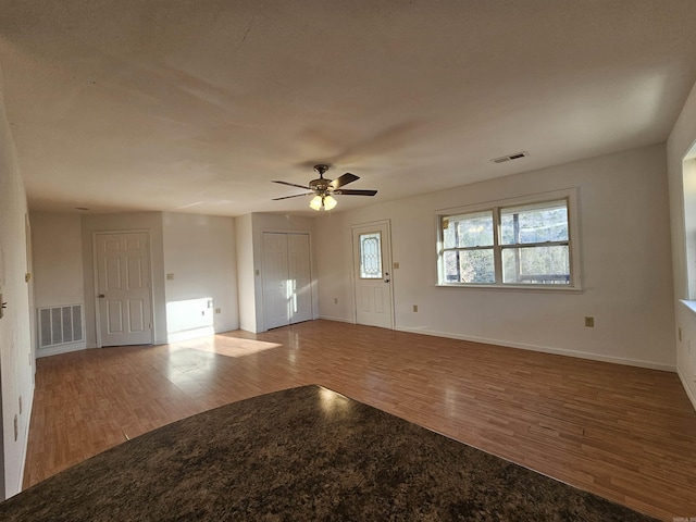 interior space featuring hardwood / wood-style flooring and ceiling fan