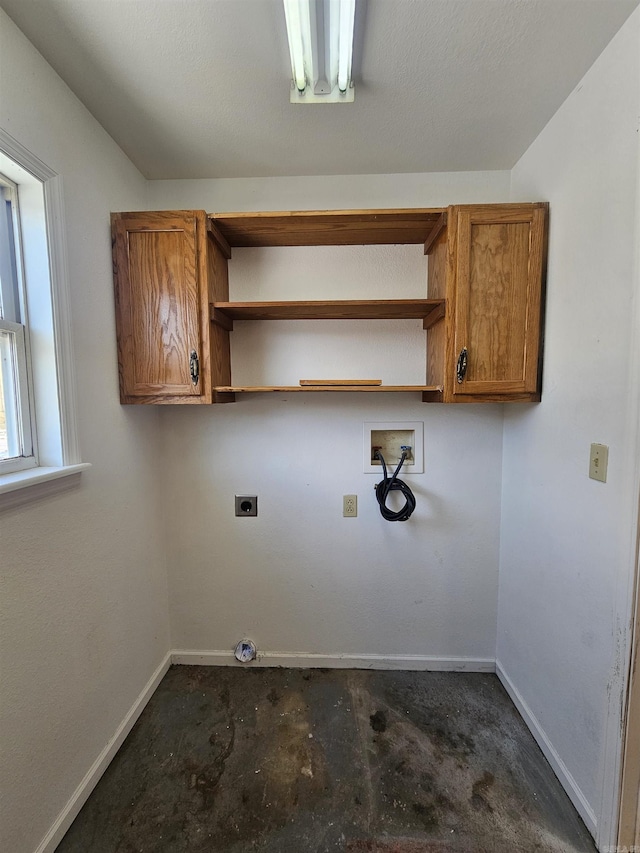 laundry room featuring hookup for a washing machine, cabinets, and hookup for an electric dryer