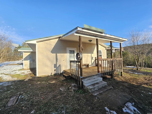 view of front of home with a wooden deck