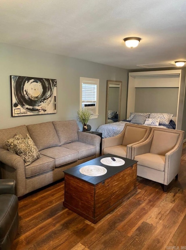 living room featuring dark hardwood / wood-style flooring