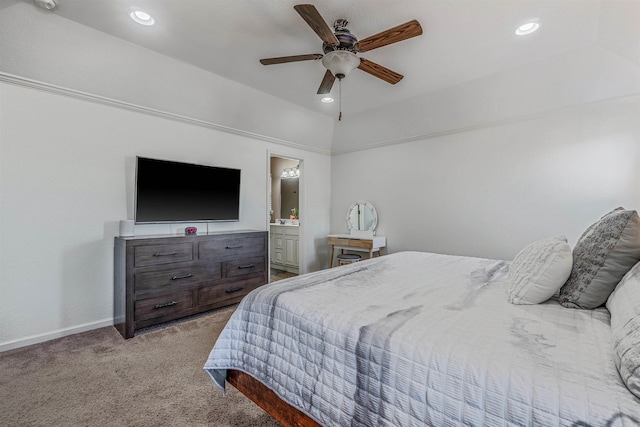 carpeted bedroom with ceiling fan, ensuite bath, and lofted ceiling