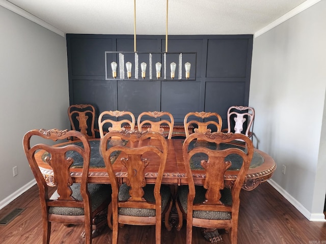 dining space featuring ornamental molding and dark wood-type flooring