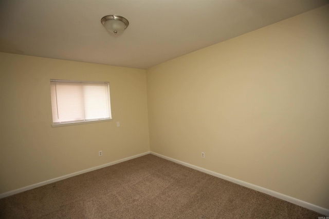 empty room with carpet flooring