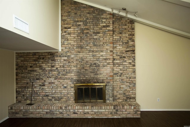 room details featuring hardwood / wood-style floors and a fireplace