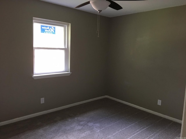 carpeted empty room featuring ceiling fan