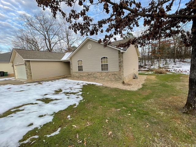 view of snowy exterior featuring a lawn