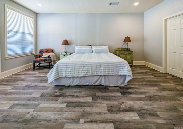 bedroom featuring dark hardwood / wood-style flooring