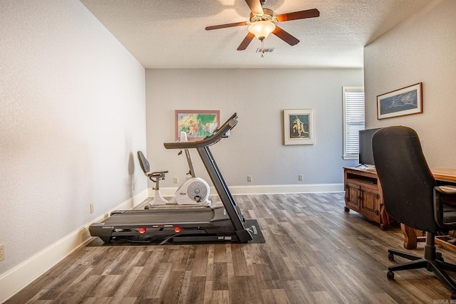 interior space with dark hardwood / wood-style flooring, a textured ceiling, and ceiling fan