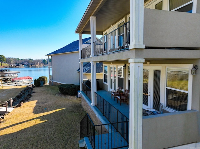 view of side of home featuring a water view