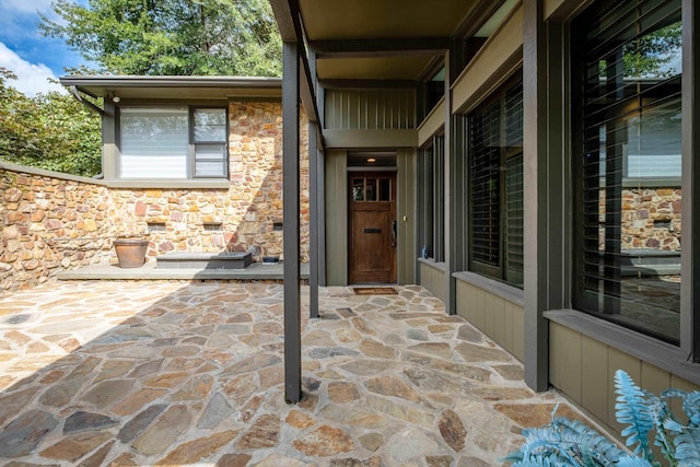 entrance to property featuring a patio area