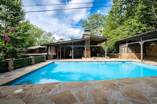 view of pool featuring a patio area