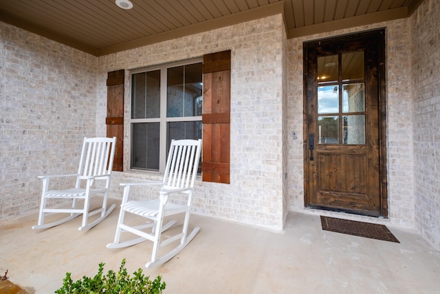 property entrance featuring covered porch