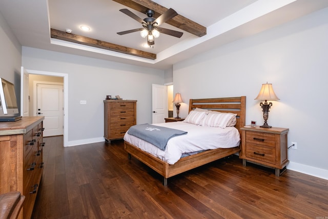 bedroom with a raised ceiling, ceiling fan, and dark hardwood / wood-style flooring